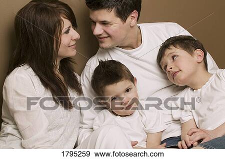 Stock Photo - Portrait of a young family. Fotosearch