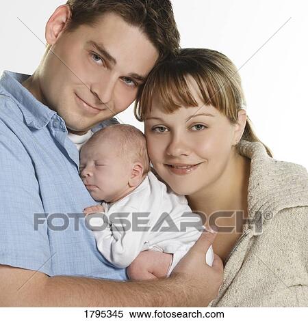 Stock Photography - Portrait of a young family. Fotosearch