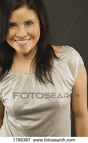 Portrait of a young woman View Large Photo Image Stock Photo - Portrait of a young woman. Fotosearch