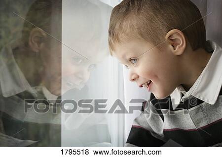 Smiling at his window friend View Large Photo Image Stock Photo - Smiling at his window friend. Fotosearch