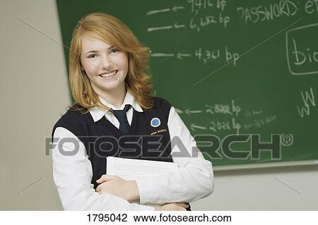 Stock Image - Student in a classroom. Fotosearch