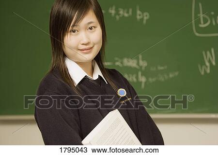 Stock Image - Student in classroom. Fotosearch