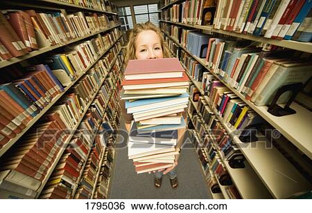 Student in the library View Large Photo Image Stock Photograph - Student in the library. Fotosearch