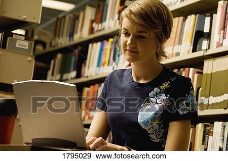 Stock Photo - Student with a lap top computer. Fotosearch