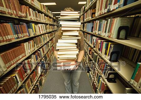 Student with large stack of books View Large Photo Image Stock Photography - Student with large stack of books. Fotosearch