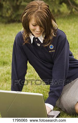 Stock Photography - Student working on a laptop. Fotosearch