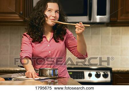 Teenager cooking View Large Photo Image Stock Photography - Teenager cooking. Fotosearch