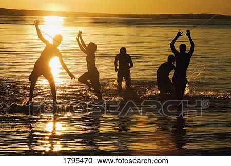 Stock Image - Teens swimming. Fotosearch