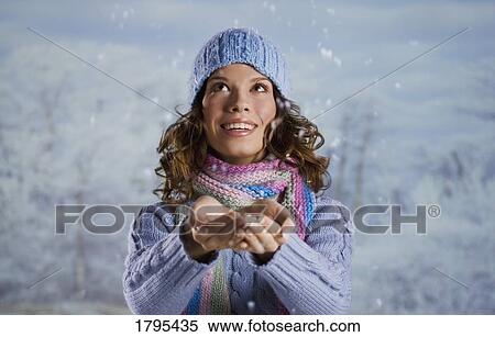 Woman catching snow View Large Photo Image Stock Photography - Woman catching snow. Fotosearch