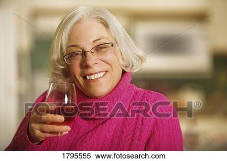 Stock Photography - Woman drinking a beverage. Fotosearch
