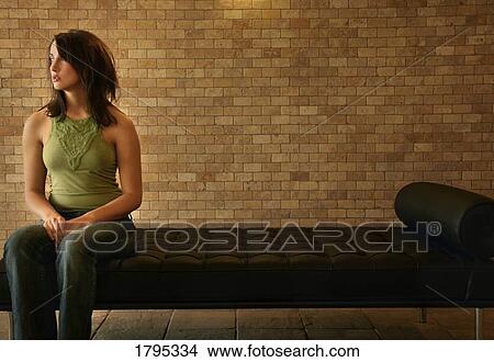 Woman sitting alone on View Large Photo Image Picture - Woman sitting alone on. Fotosearch
