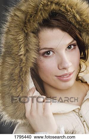 Woman wearing a hoodie View Large Photo Image Stock Image - Woman wearing a hoodie. Fotosearch