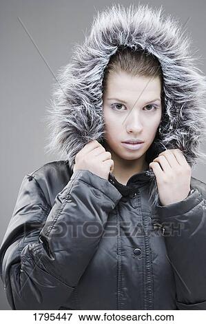 Stock Photo - Woman wearing a winter jacket. Fotosearch