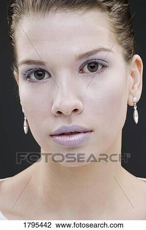 Stock Image - Woman wearing icy makeup. Fotosearch