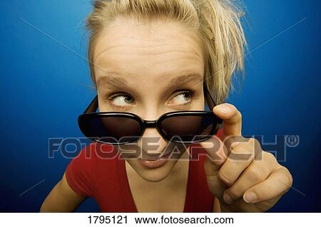 Stock Image - Woman wearing sunglasses. Fotosearch