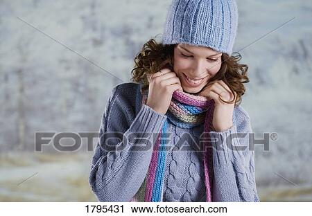 Stock Image - Woman wearing winter clothing. Fotosearch