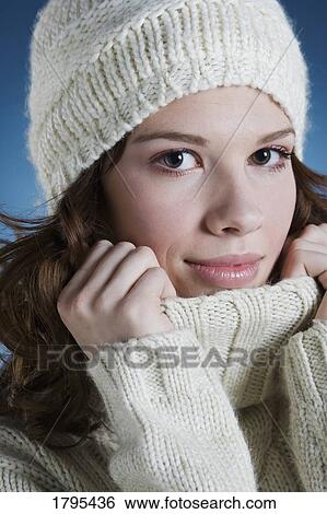 Stock Photograph - Woman wearing winter clothing. Fotosearch