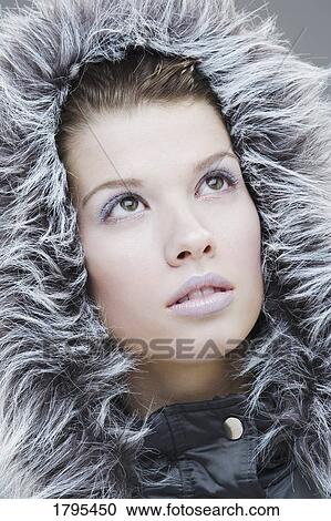 Stock Image - Woman with fur hood. Fotosearch