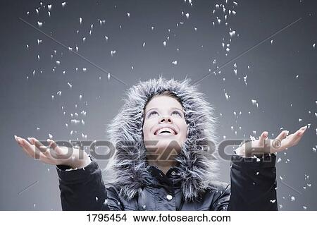 Woman with open hands to falling snow View Large Photo Image Picture - Woman with open hands to falling snow. Fotosearch