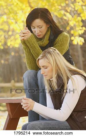 Women praying View Large Photo Image Picture - Women praying. Fotosearch