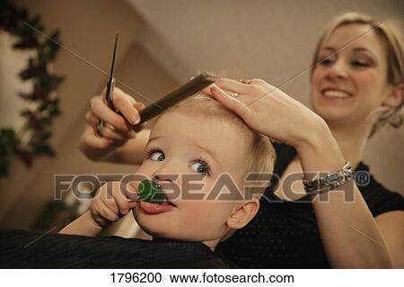 Boy getting a haircut View Large Photo Image Stock Image - Boy getting a haircut. Fotosearch
