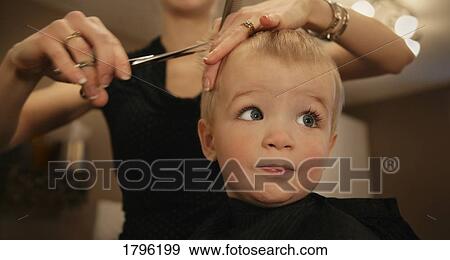 Stock Photo - Boy getting a haircut. Fotosearch