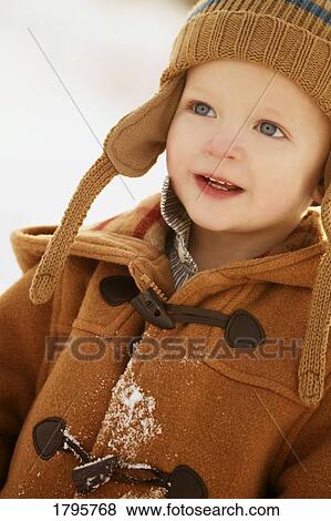 Boy wearing winter clothing View Large Photo Image Stock Photo - Boy wearing winter clothing. Fotosearch
