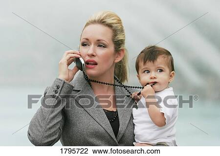 Career mom managing business and family View Large Photo Image Stock Image - Career mom managing business and family. Fotosearch