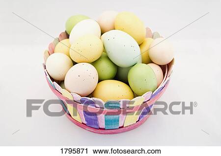 Easter eggs in a basket View Large Photo Image Stock Image - Easter eggs in a basket. Fotosearch