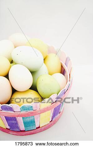 Easter eggs in a basket View Large Photo Image Stock Image - Easter eggs in a basket. Fotosearch