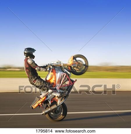Person riding a sport bike View Large Photo Image Picture - Person riding a sport bike. Fotosearch
