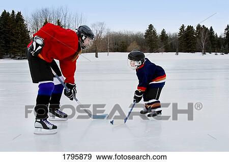 Playing hockey View Large Photo Image Stock Photo - Playing hockey. Fotosearch