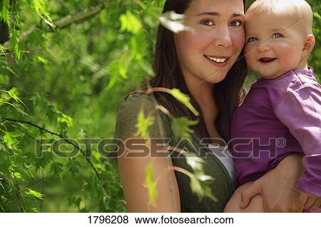 Portrait of a mother and daughter View Large Photo Image Stock Photo - Portrait of a mother and daughter . Fotosearch