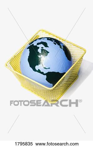The Earth in a waste basket View Large Photo Image Stock Photography - The Earth in a waste basket. Fotosearch