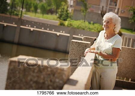 Woman enjoying the outdoors View Large Photo Image Stock Photograph - Woman enjoying the outdoors. Fotosearch