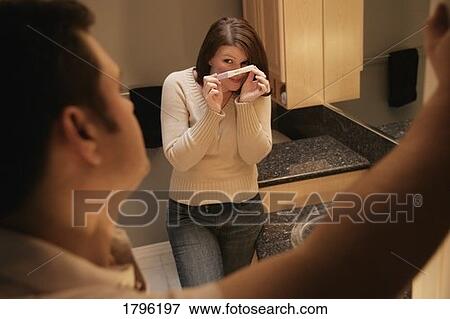 Woman finds out she's pregnant View Large Photo Image Stock Photo - Woman finds out she's pregnant. Fotosearch