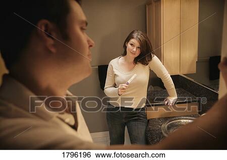 Woman holding a pregnancy test View Large Photo Image Stock Photograph - Woman holding a pregnancy test. Fotosearch