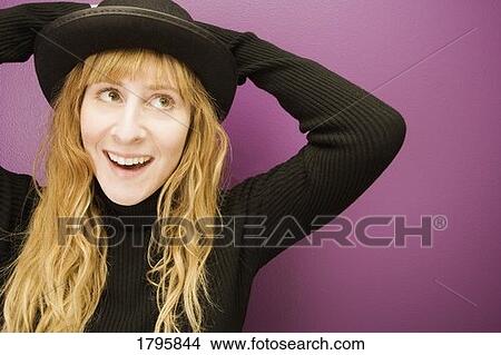 Picture - Woman wearing a hat. Fotosearch