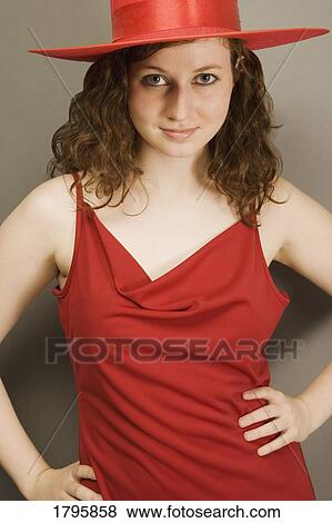 Stock Photo - Woman wearing a red hat and dress. Fotosearch