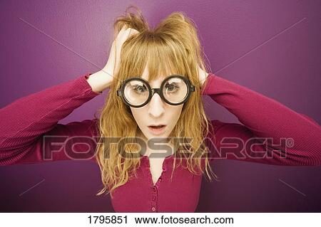 Woman wearing prop eyeglasses View Large Photo Image Stock Image - Woman wearing prop eyeglasses. Fotosearch
