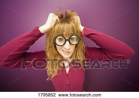 Woman wearing prop eyeglasses View Large Photo Image Stock Image - Woman wearing prop eyeglasses. Fotosearch