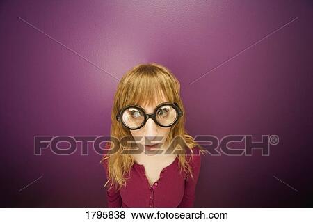 Woman wearing prop glasses View Large Photo Image Stock Photo - Woman wearing prop glasses. Fotosearch