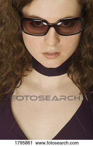 Woman wearing sunglasses View Large Photo Image Stock Image - Woman wearing sunglasses. Fotosearch