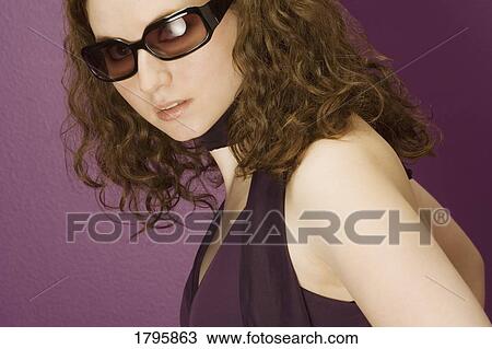 Woman wearing sunglasses View Large Photo Image Stock Image - Woman wearing sunglasses. Fotosearch