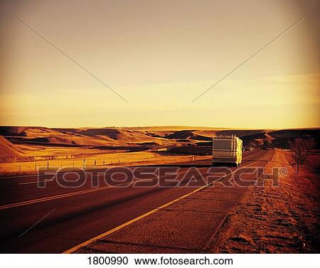 Stock Image - A recreational vehicle travelling down a hiway. Fotosearch