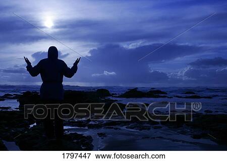 Stock Photo - A sunset over a wheat field. Fotosearch
