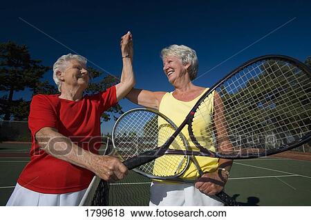 Stock Photo - At the tennis court. Fotosearch
