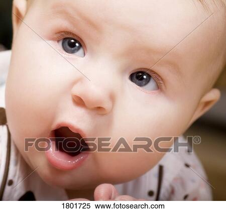 Stock Photography - Baby looking surprised. Fotosearch