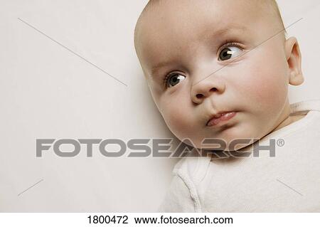 Stock Image - Baby looking to the side. Fotosearch