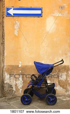 Stock Photo - Baby stroller on street in Italy . Fotosearch